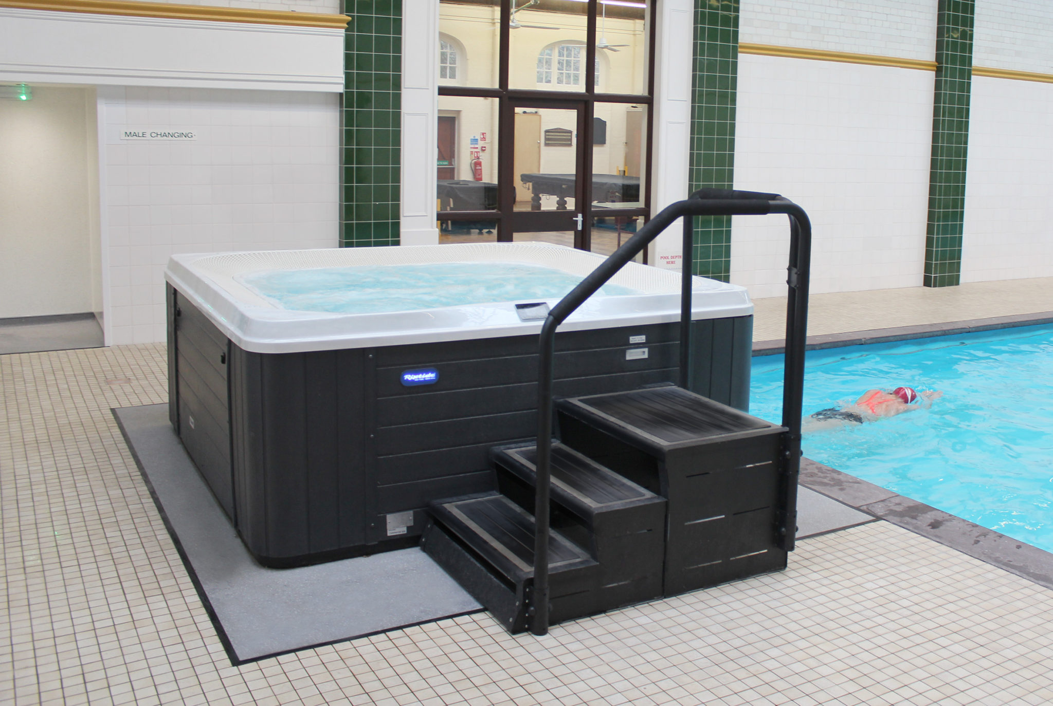 riverflow commercial hot tub by the pool